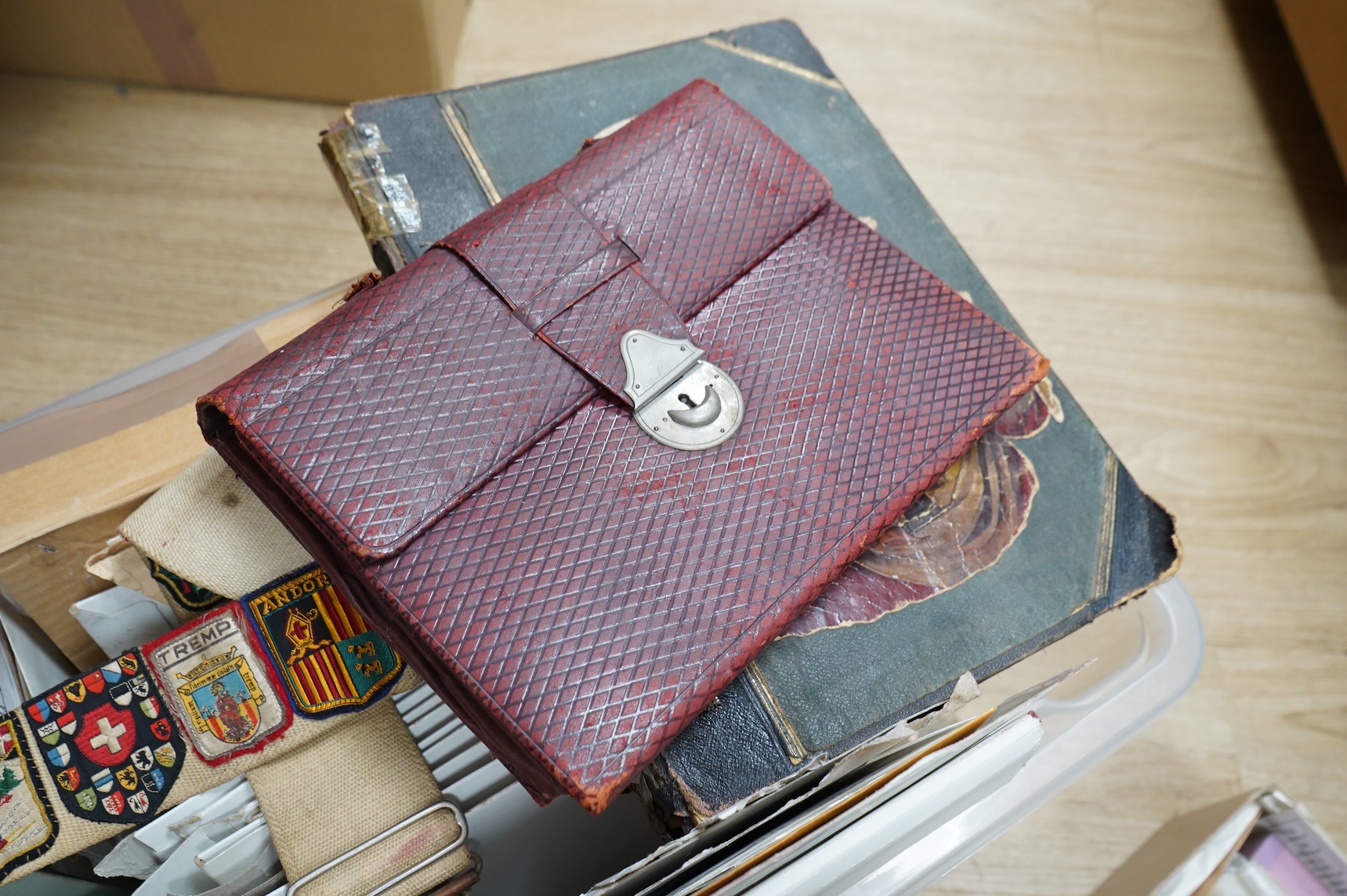 A collection of sundry items to include a scrapbook and a large collection of various stamps